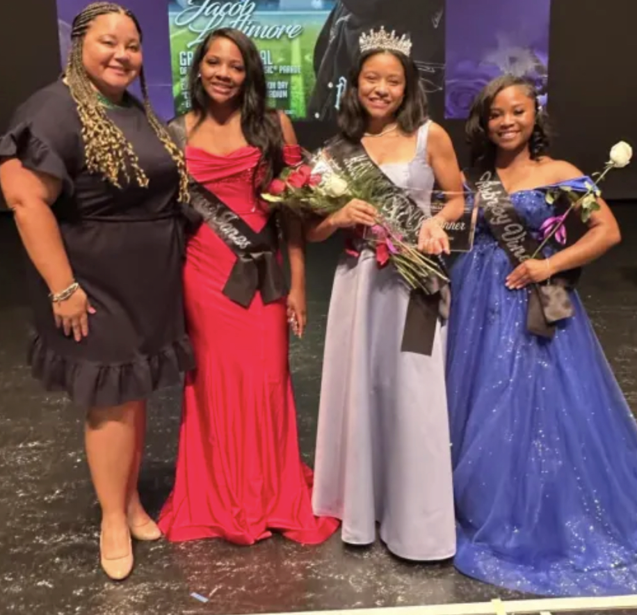 Seniors Regina Jones, Leilani Jones, and Aubrey Vines standing with Jean Smith after the Miss Circle City Coronation. Regina Jones won first place and Aubrey Vines placed in the top ten. Smith said, “The coronation is always a great event that allows each participant to shine in her own right.” 
Photo from Cathedral Instagram